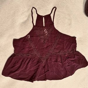 Maroon, spaghetti strap, halter style top with lace cutouts by L.A. Hearts